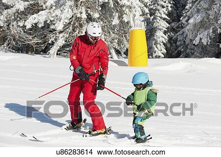 Boy having skiing lesson View Large Photo Image Picture - Boy having skiing lesson. Fotosearch