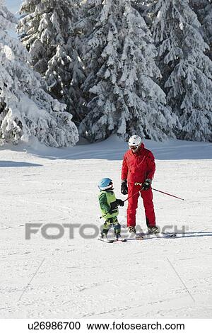 Boy having skiing lesson View Large Photo Image Stock Image - Boy having skiing lesson. Fotosearch