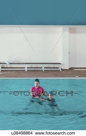 Picture - Boy in swimming class. Fotosearch