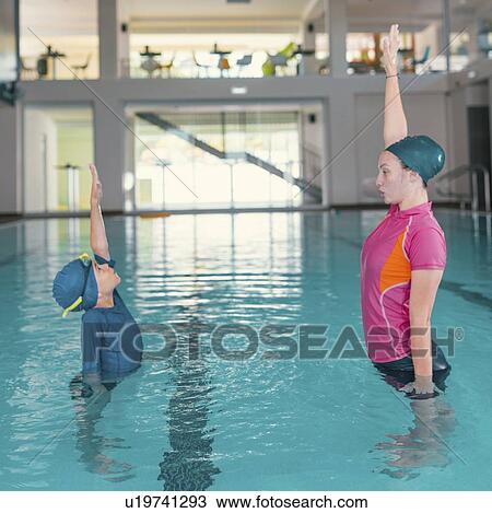 Stock Image - Boy in swimming class. Fotosearch
