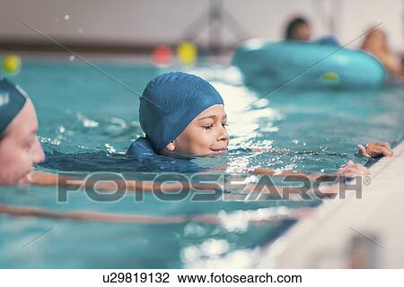 Boy in swimming class View Large Photo Image Stock Image - Boy in swimming class. Fotosearch