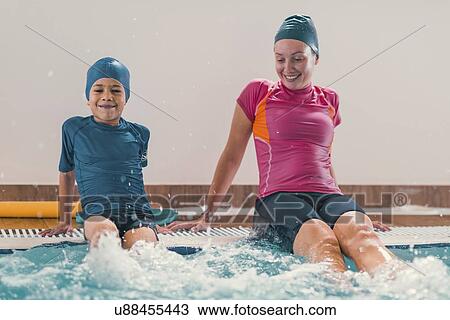 Stock Image - Boy in swimming class. Fotosearch