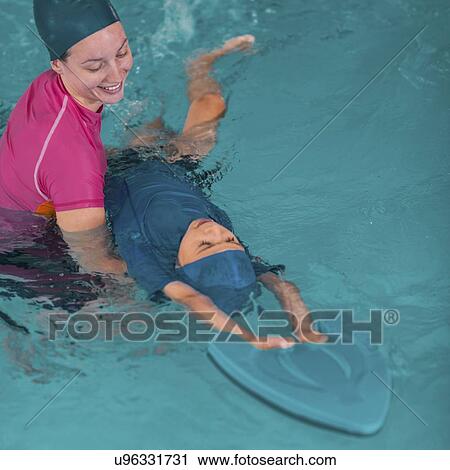 Stock Image - Boy in swimming class. Fotosearch