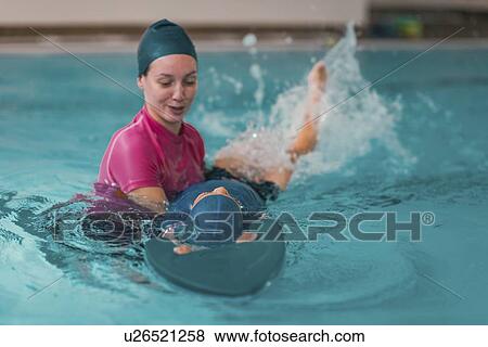 Stock Photo - Boy in swimming class. Fotosearch