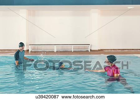 Stock Photo - Boy in swimming class. Fotosearch