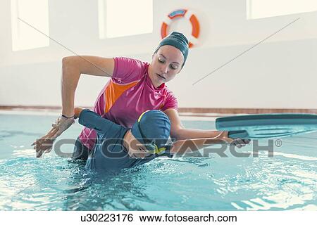 Stock Photograph - Boy in swimming class. Fotosearch