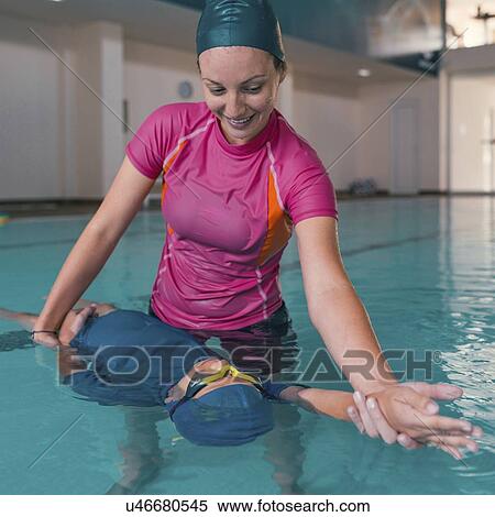Stock Photography - Boy in swimming class. Fotosearch