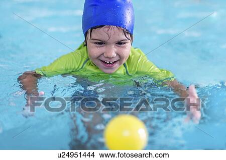 Picture - Boy in swimming pool. Fotosearch
