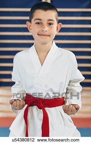 Stock Image - Boy in taekwondo class. Fotosearch