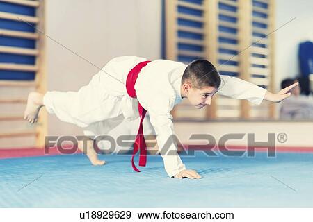 Boy in taekwondo class View Large Photo Image Stock Photo - Boy in taekwondo class. Fotosearch