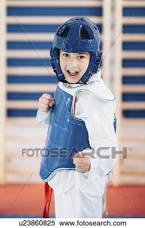 Stock Photography - Boy in taekwondo class. Fotosearch