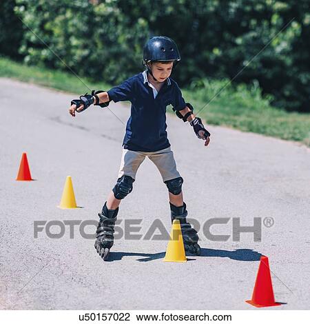 Boy learning to roller skate View Large Photo Image Stock Image - Boy learning to roller skate. Fotosearch