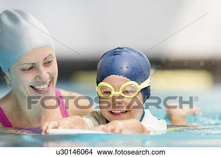 Picture - Boy learning to swim. Fotosearch