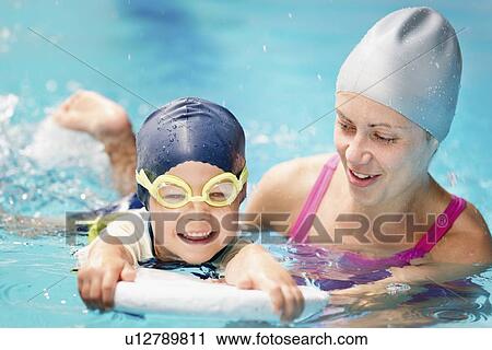 Boy learning to swim View Large Photo Image Stock Image - Boy learning to swim. Fotosearch
