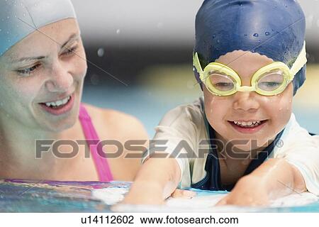 Stock Image - Boy learning to swim. Fotosearch