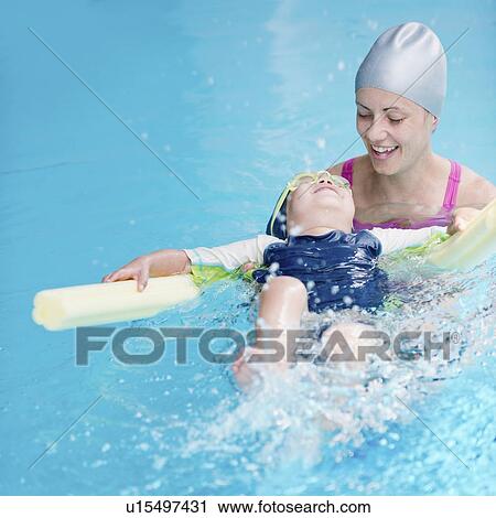 Stock Image - Boy learning to swim. Fotosearch