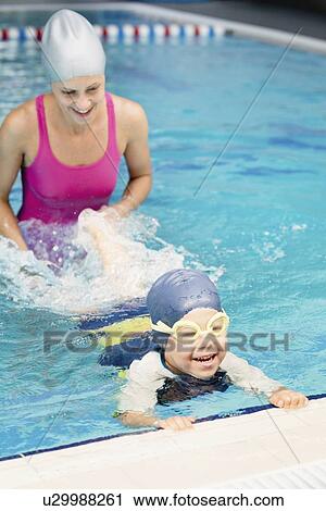 Boy learning to swim View Large Photo Image Stock Image - Boy learning to swim. Fotosearch