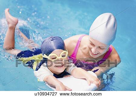 Stock Photo - Boy learning to swim. Fotosearch