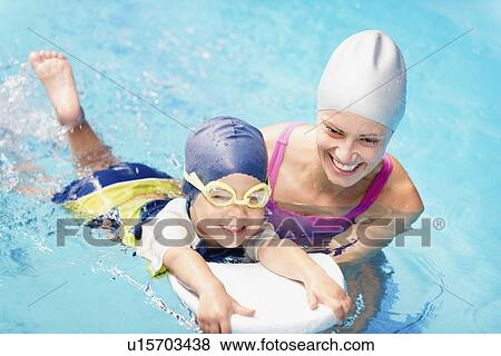 Boy learning to swim View Large Photo Image Stock Photo - Boy learning to swim. Fotosearch