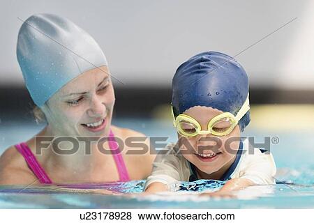 Stock Photo - Boy learning to swim. Fotosearch