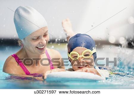Stock Photo - Boy learning to swim. Fotosearch