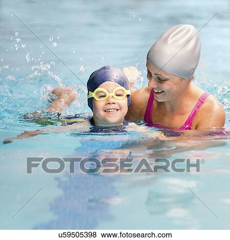 Stock Photo - Boy learning to swim. Fotosearch