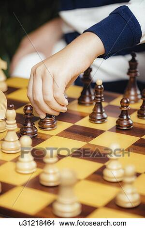 Picture - Boy playing chess. Fotosearch