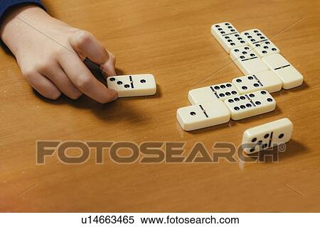 Boy playing dominoes View Large Photo Image Stock Photography - Boy playing dominoes. Fotosearch