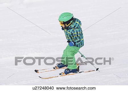 Boy skiing down hill View Large Photo Image Stock Image - Boy skiing down hill. Fotosearch