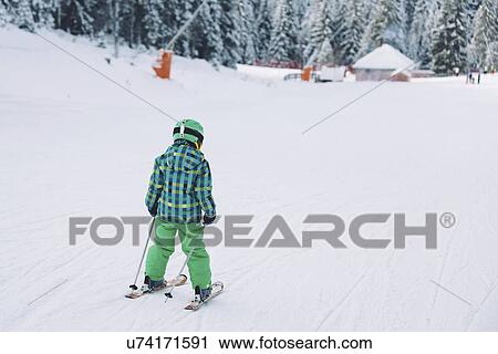 Stock Image - Boy skiing. Fotosearch
