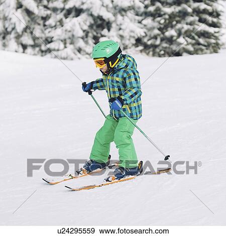 Stock Photo - Boy skiing. Fotosearch