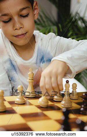 Boys playing chess View Large Photo Image Stock Photograph - Boys playing chess. Fotosearch