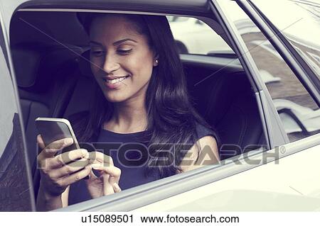Business woman sitting in car View Large Photo Image Stock Image - Business woman sitting in car. Fotosearch