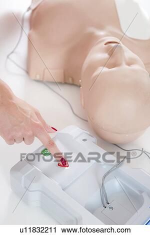 Stock Image - Cardiopulmonary resuscitation training. Fotosearch