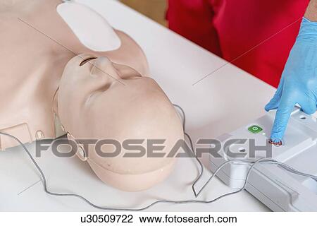 Stock Image - Cardiopulmonary resuscitation training. Fotosearch
