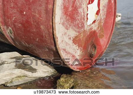 Stock Image - Chemical substance leaking into a river#. Fotosearch