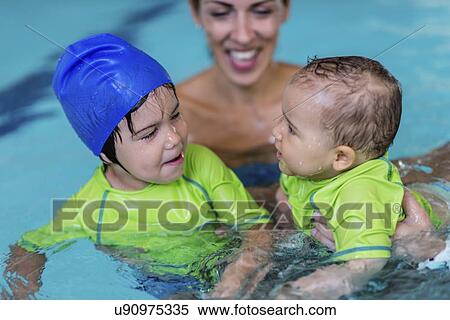 Children in swimming pool with mother View Large Photo Image Stock Photography - Children in swimming pool with mother. Fotosearch
