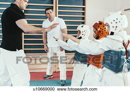 Children in taekwondo class View Large Photo Image Stock Image - Children in taekwondo class. Fotosearch
