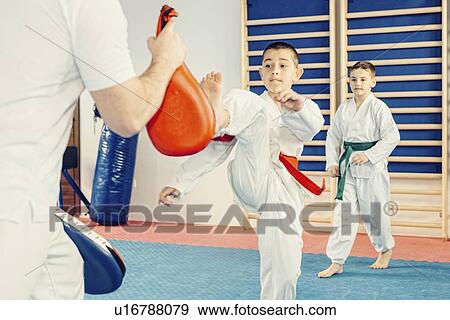 Stock Photo - Children in taekwondo class. Fotosearch