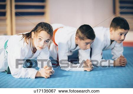 Stock Photo - Children in taekwondo class. Fotosearch