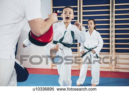 Children in taekwondo class View Large Photo Image Stock Photography - Children in taekwondo class. Fotosearch