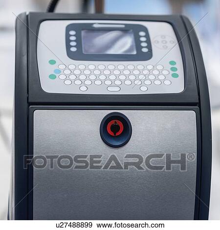 Stock Photo - Continuous inkjet printer. Fotosearch