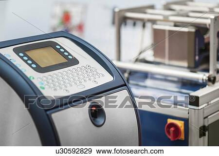 Stock Photo - Continuous inkjet printer. Fotosearch