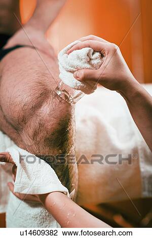 Stock Image - Cryo massage for knee pain. Fotosearch