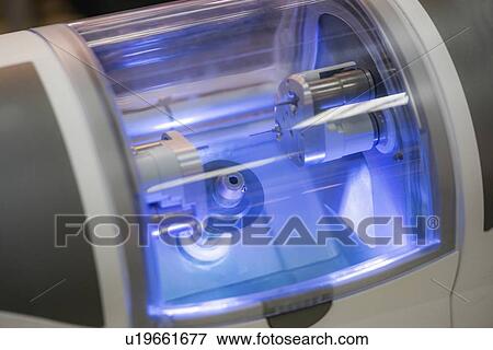 Stock Photo - Dental ceramic reconstruction milling machine. Fotosearch