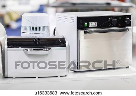 Stock Image - Dry sterilisers for dental equipment. Fotosearch