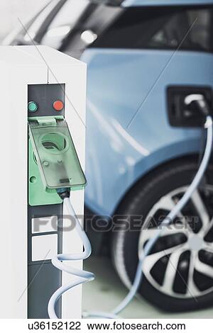 Electric vehicle charging View Large Photo Image Stock Image - Electric vehicle charging. Fotosearch