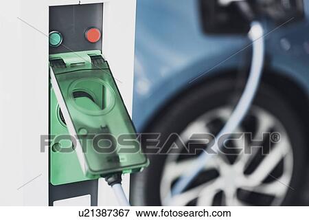 Stock Photo - Electric vehicle charging. Fotosearch