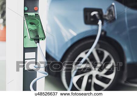 Stock Photo - Electric vehicle charging. Fotosearch