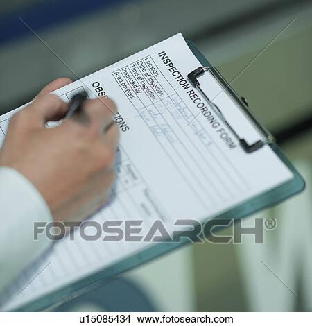 Picture - Engineer working in factory. Fotosearch